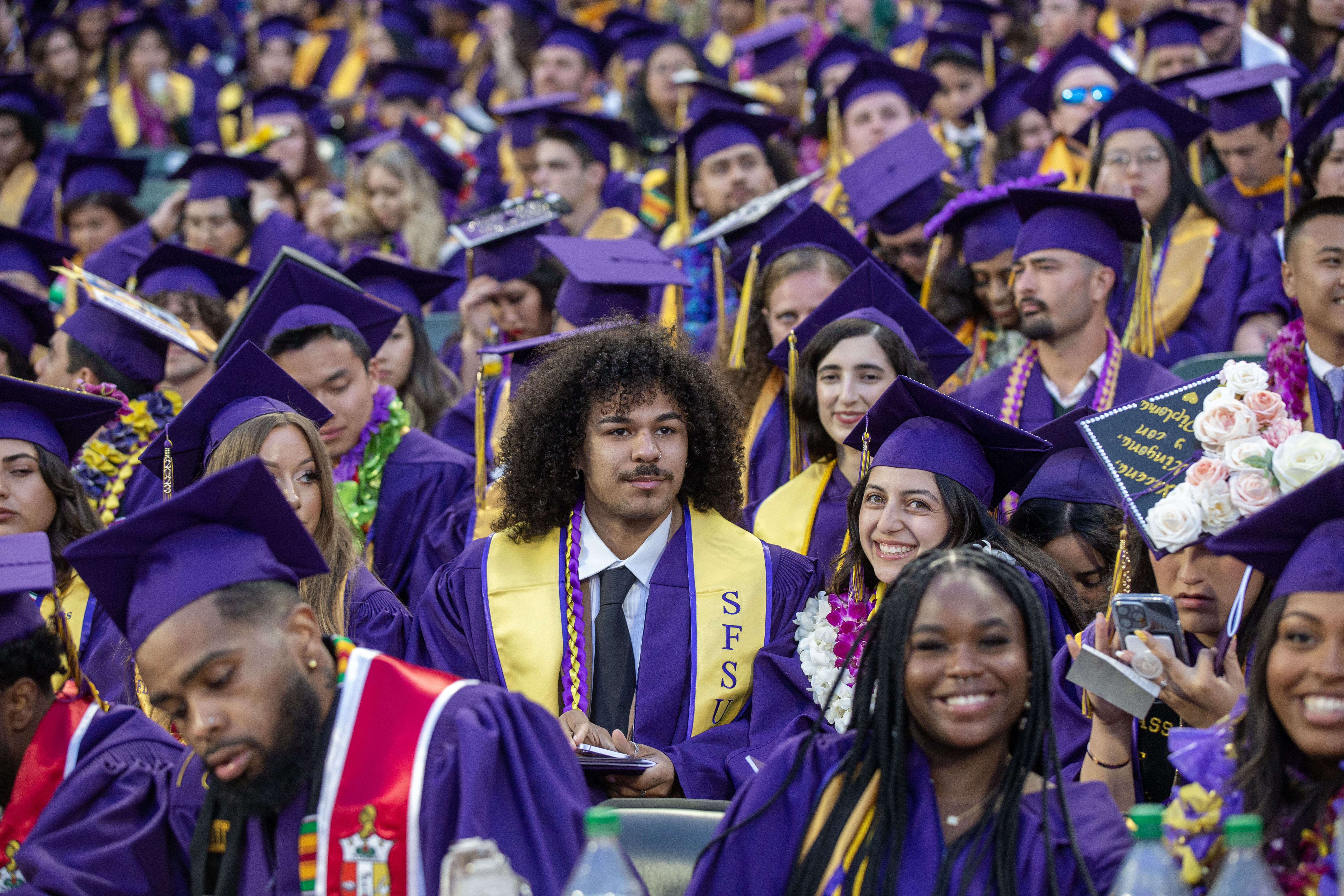 group photo of candidates awaiting graduation from SFSU